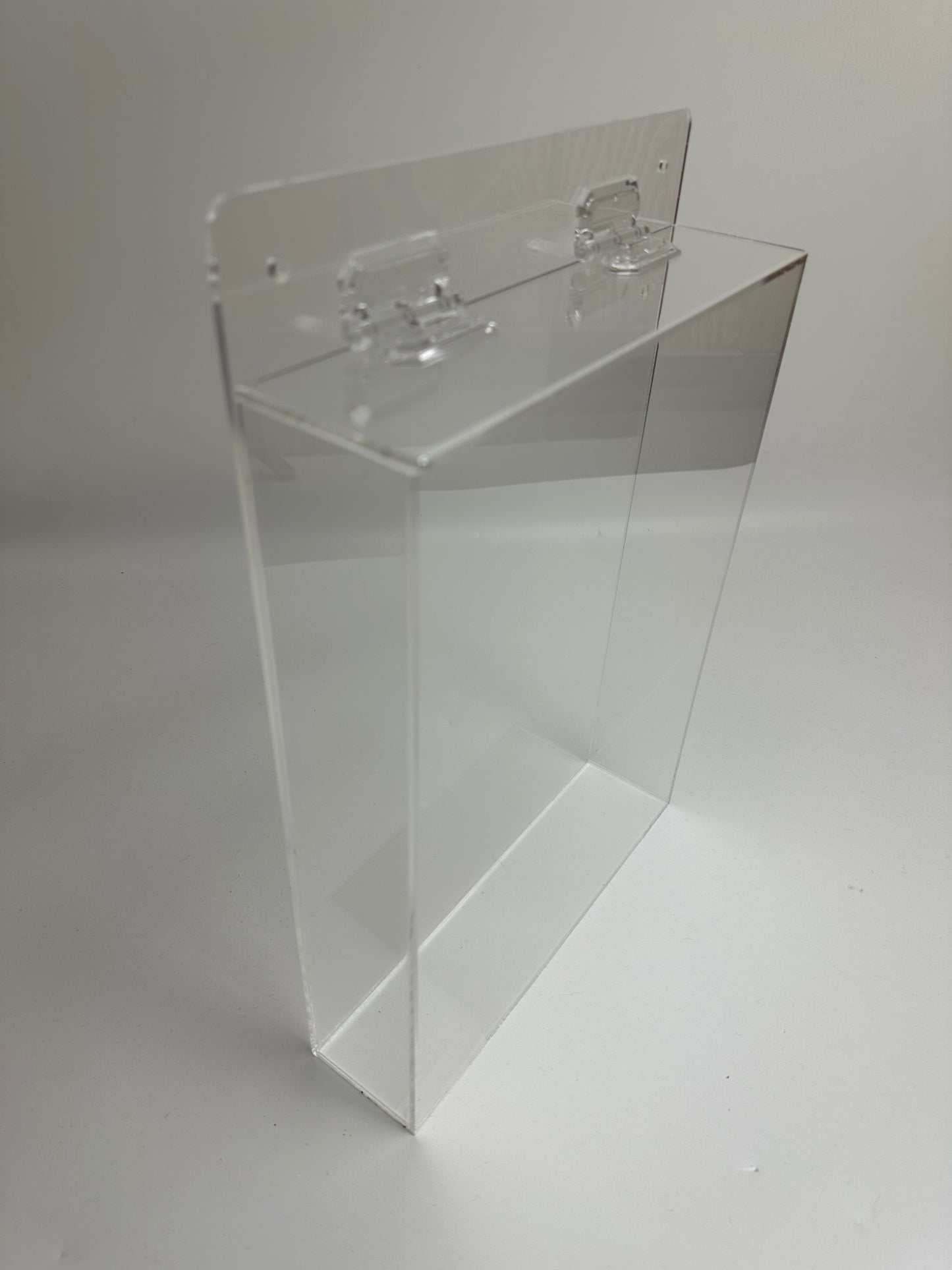 Wall mounted custom made acrylic box with hinged top lid
